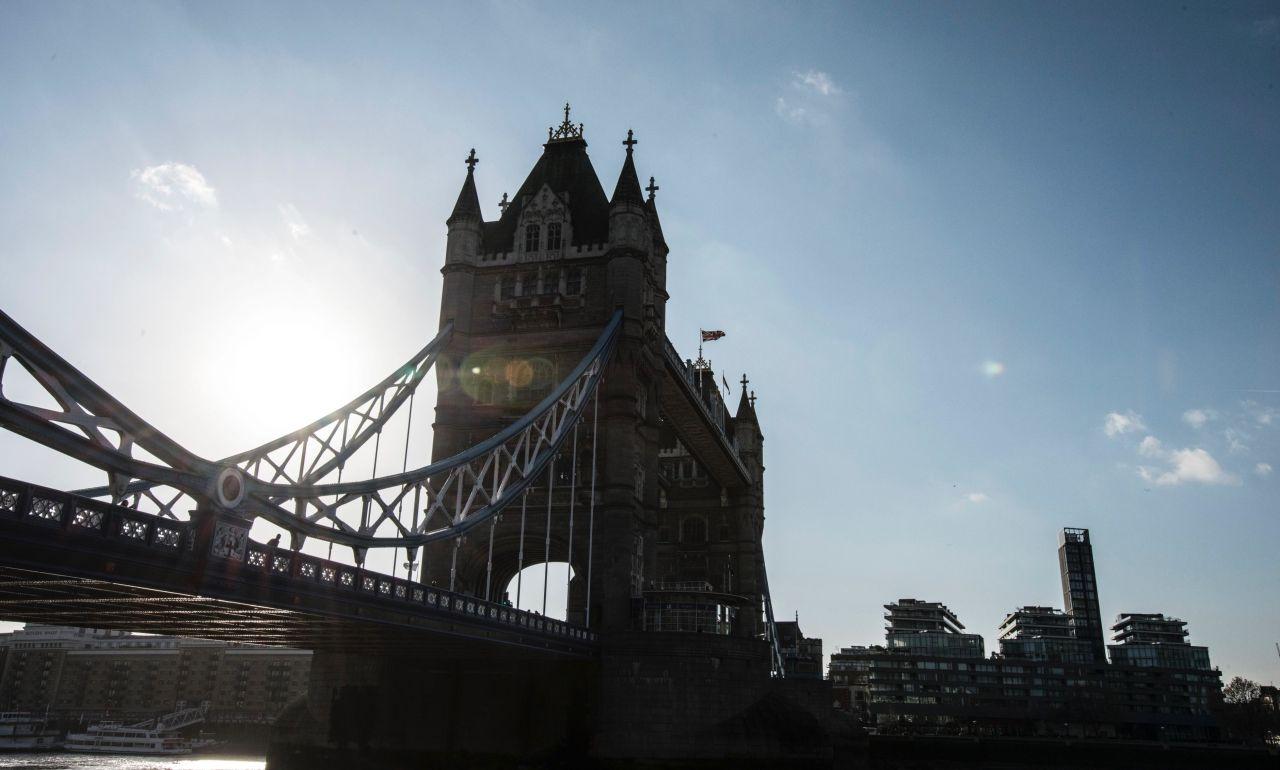 Tower Bridge lifts to let boats pass through.